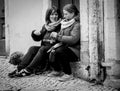 Adult women with dog chatting on street dogs