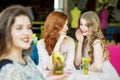 Adult women gossip behind their rivals. The concept of lifestyle, gossip, lies, friendship Royalty Free Stock Photo