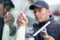 adult worker cleaning glass window with squeegee Royalty Free Stock Photo