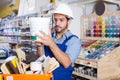 Adult workman choosing materials