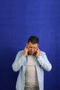Adult 40-year-old brown Latino man suffers from pain in the ears due to otitis, hypocausia or vertigo Royalty Free Stock Photo