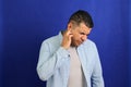 Adult 40-year-old brown Latino man suffers from pain in the ears due to otitis, hypocausia or vertigo Royalty Free Stock Photo