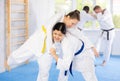 Adult and young women training judo techniques Royalty Free Stock Photo