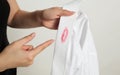 Adultery: a woman with a shirt with traces of lipstick