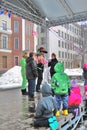 Adults and children celebrate Shrovetide.