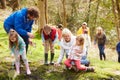 Adults And Children Exploring Pond At Activity Centre Royalty Free Stock Photo