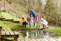 Adults And Children Exploring Pond At Activity Centre Royalty Free Stock Photo