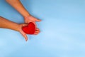 Adults and children hands holding red heart Royalty Free Stock Photo