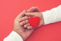 Adults and children hands holding red heart, healthcare, donation and family insurance concept, world heart day, world health day Royalty Free Stock Photo