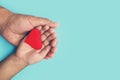 Adults and children hands holding a red heart, healthcare, love and family insurance concept, world heart day, world health day, f