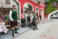 Adults and children wearing traditional Austrian custume for Pentecost