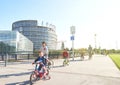 Adults, childrens on bicycles in Strasbourg, European Parliament