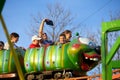 Adults and childrens ride on the Russian roller coaster Royalty Free Stock Photo