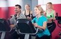 Adults in gym working out at group class Royalty Free Stock Photo