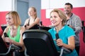 Adults in gym working out at group class Royalty Free Stock Photo