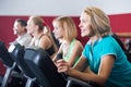 Adults in gym working out at group class Royalty Free Stock Photo