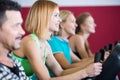 Adults in gym working out at group class Royalty Free Stock Photo