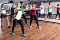 Adults having group fitness class