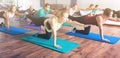 Adults having yoga class in sport club