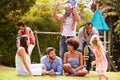 Adults and kids having fun in a garden Royalty Free Stock Photo