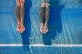 Adults legs underwater in the swimming pool