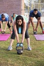 Adults Lifting Kettle Bell Weights