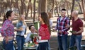 Adults relaxing at grill party Royalty Free Stock Photo