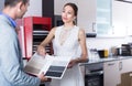 Adutl couple is choosing material for countertop Royalty Free Stock Photo