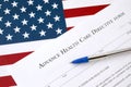 Advance health care directive blank form and blue pen on United States flag Royalty Free Stock Photo