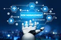 Advanced Cyber Risk Management and Assessment Concept Visualized by a Robotic Hand Interface with Data Icons in a Royalty Free Stock Photo