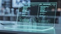 Advanced cybersecurity interface on transparent laptop screen Royalty Free Stock Photo