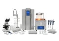 Advanced laboratory equipment setup featuring microscope, centrifuge, and various lab tools on a workbench Royalty Free Stock Photo
