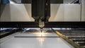 An advanced laser ting machine precisely slicing through thick coils of wire with beams of light surrounded by a clean Royalty Free Stock Photo