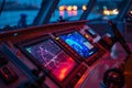 Advanced marine GPS and radar touchscreen glowing at night on ship bridge Royalty Free Stock Photo