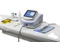 Advanced medical laser device on a clinical table with accessories and protective eyewear Royalty Free Stock Photo