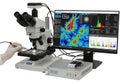 Of advanced microscope with computer display on Royalty Free Stock Photo
