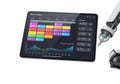 Advanced robotic arm interacting with digital tablet displaying colorful data interface Royalty Free Stock Photo
