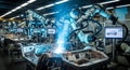 Advanced robotic arms precisely weld automotive chassis components in a modern high tech manufacturing facility Royalty Free Stock Photo