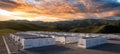 The advanced solar array and energy storage facility under a stunning sunset. AI generated image Royalty Free Stock Photo