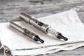 Advanced vaping device, e-cigarette on table Royalty Free Stock Photo