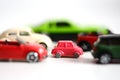 Advantages of small cars with multiple toy cars on white background Royalty Free Stock Photo