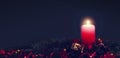 Red Advent candle with Christmas decoration isolated on black Royalty Free Stock Photo