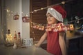 Kid by original advent calendar, ski resort made with toilette paper rolls. Magic Christmas holiday Royalty Free Stock Photo