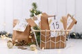 Advent calendar made from homemade craft paper bags with handwritten numbers