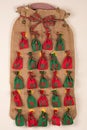 An advent calendar made of one big and small red, green bags