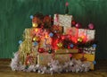 Advent calender with lush christmas decoartion,gifts wrapped gifts and lights, merry christmas,making a present concept