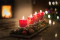 Advent candles with Christmas tree and burning chimney fire Royalty Free Stock Photo
