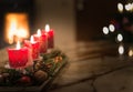 Advent candles with Christmas tree and burning chimney fire Royalty Free Stock Photo