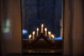advent candlestick on window sill at night