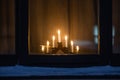 advent candlestick on window sill at night